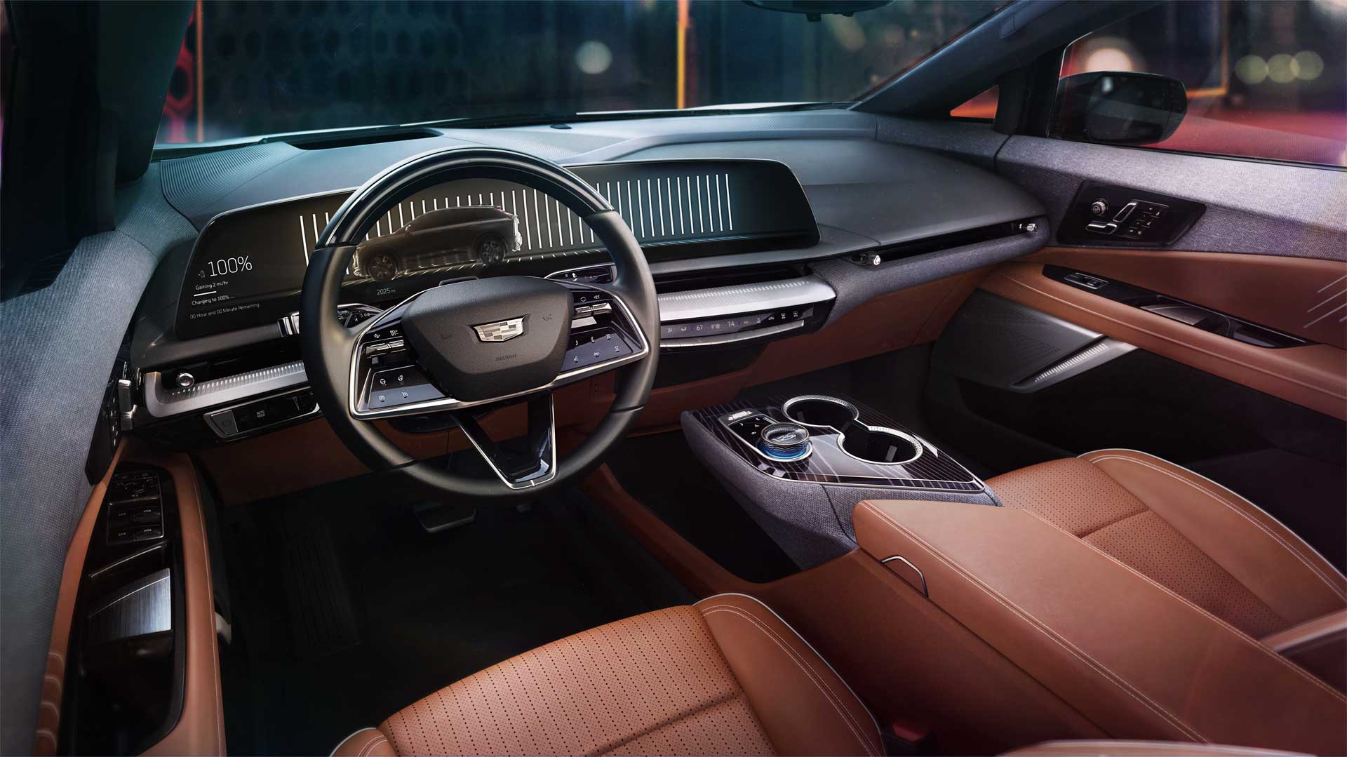 Cadillac Optiq front cabin with tan leather seats and a curved 33-inch display
