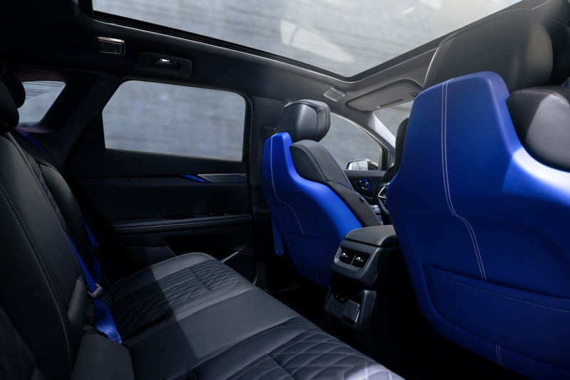 Back Seat View of the 2026 OPTIQ-V Blue Front Seats, Sun Roof, and Interior | Arnie Bauer Cadillac in Matteson IL